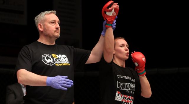 Joanne-Doyle-hand-raised